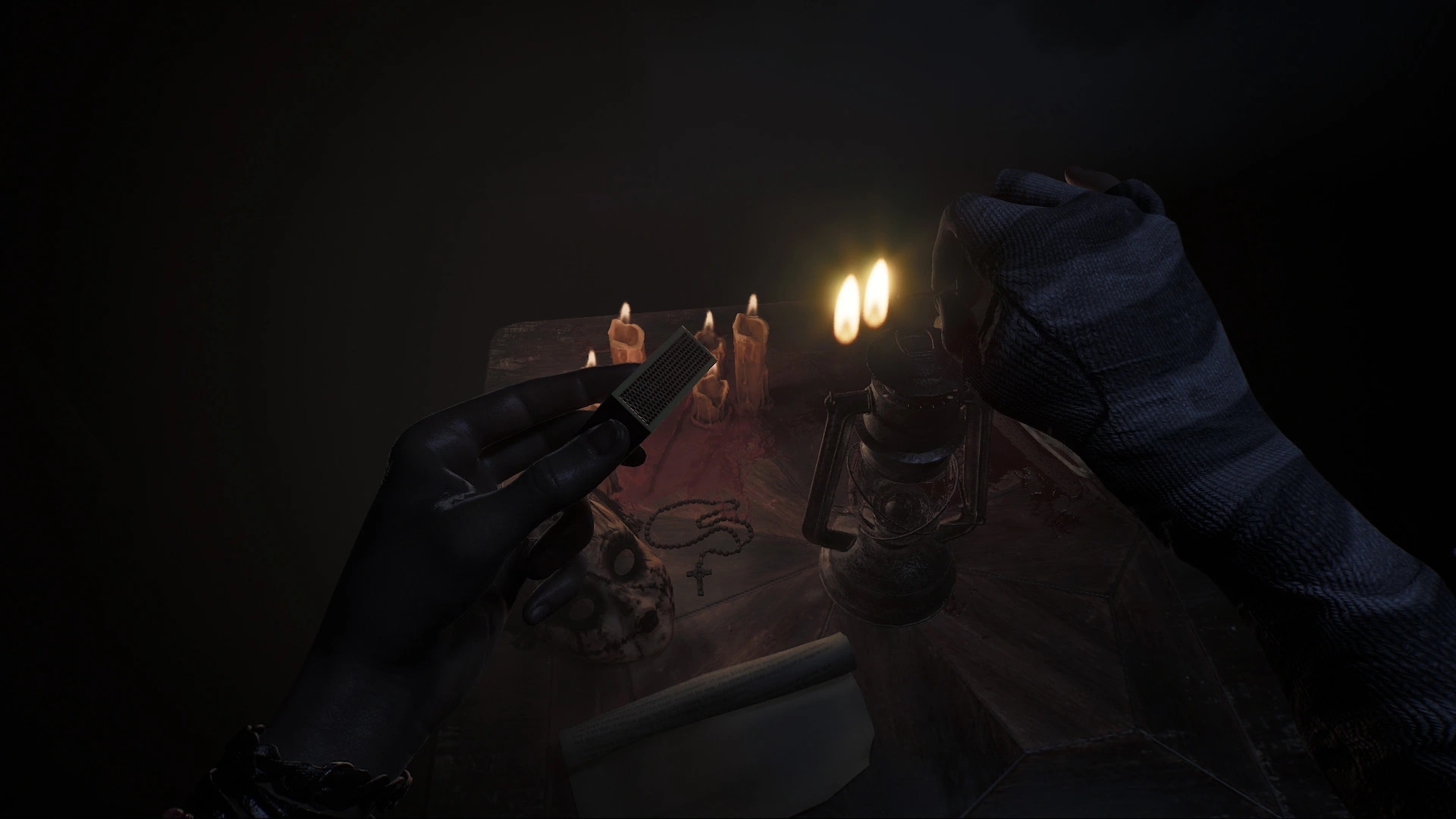 Player holding a candle in a dark room surrounded by shadows