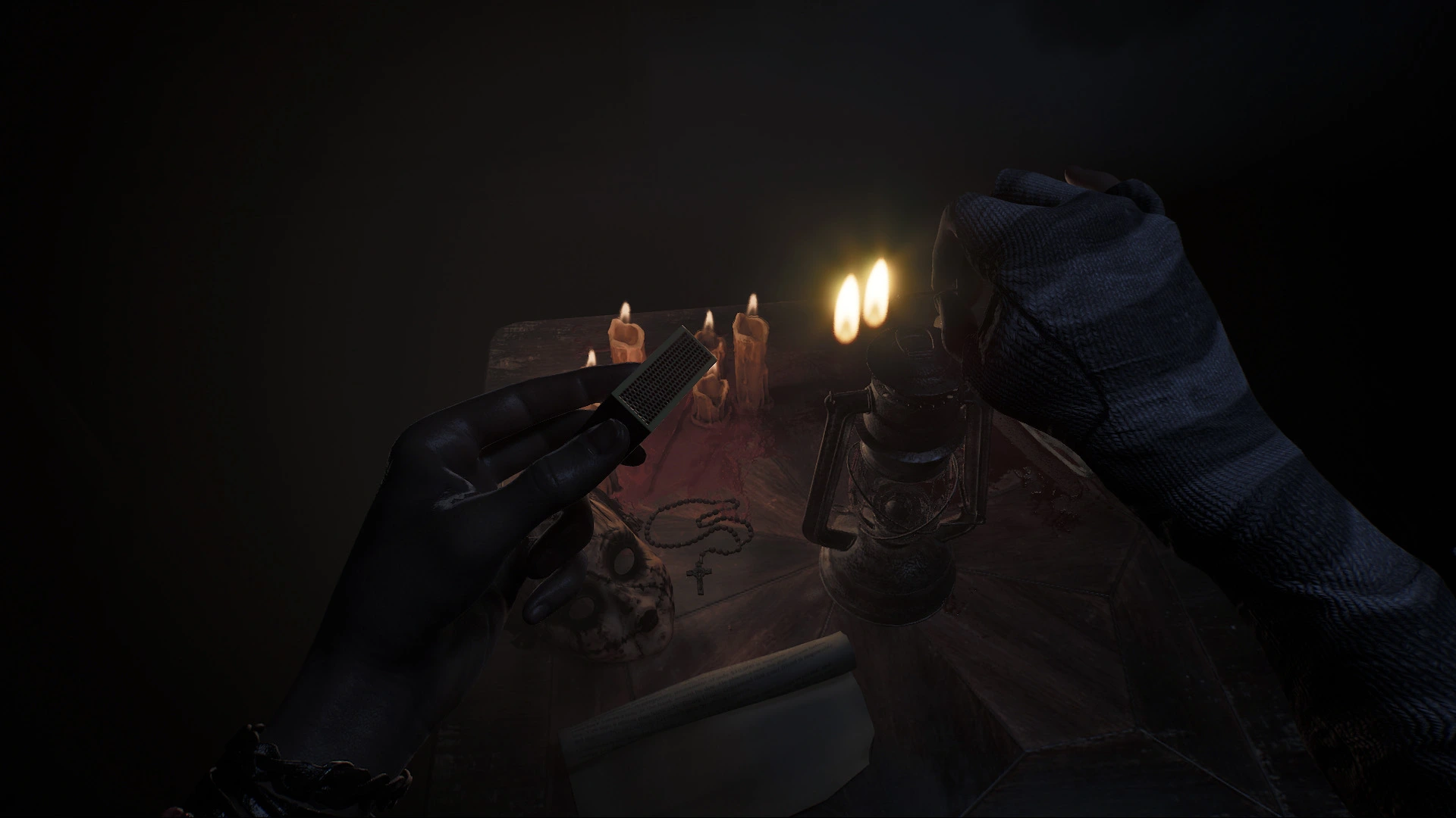 Player holding a candle in a dark room surrounded by shadows